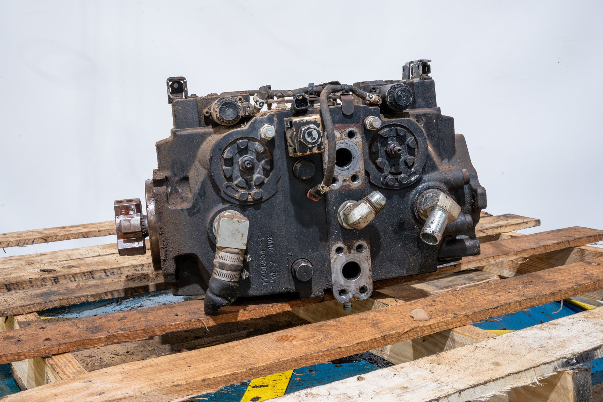 Hydrostatic Pump on wood pallet in front of white background