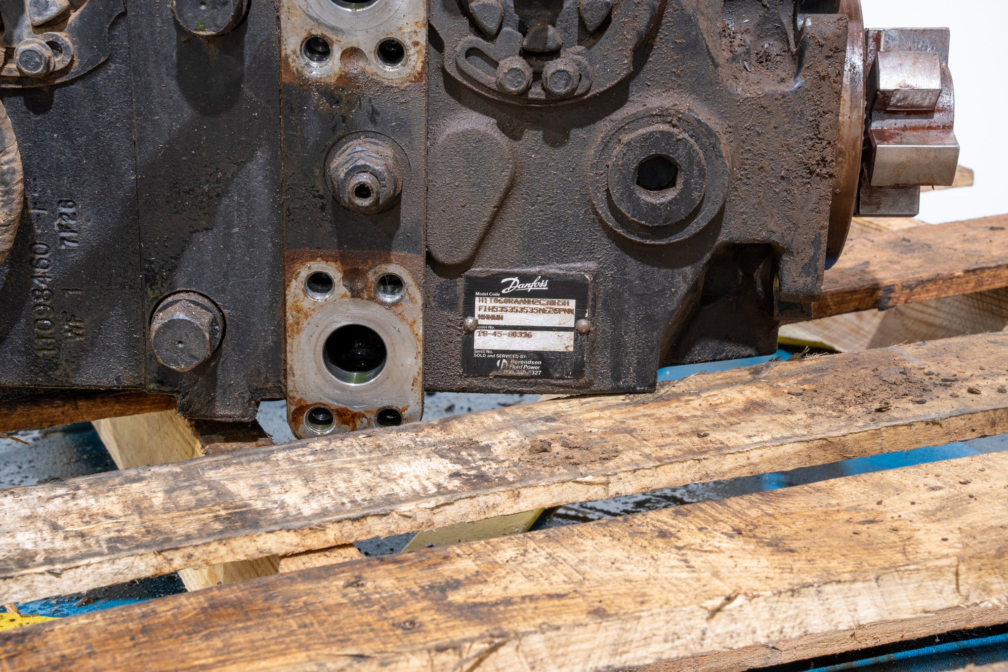 Hydrostatic Pump on wood pallet in front of white background