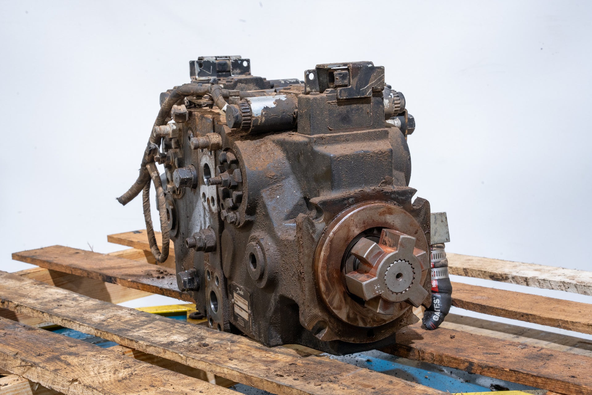 Hydrostatic Pump on wood pallet in front of white background