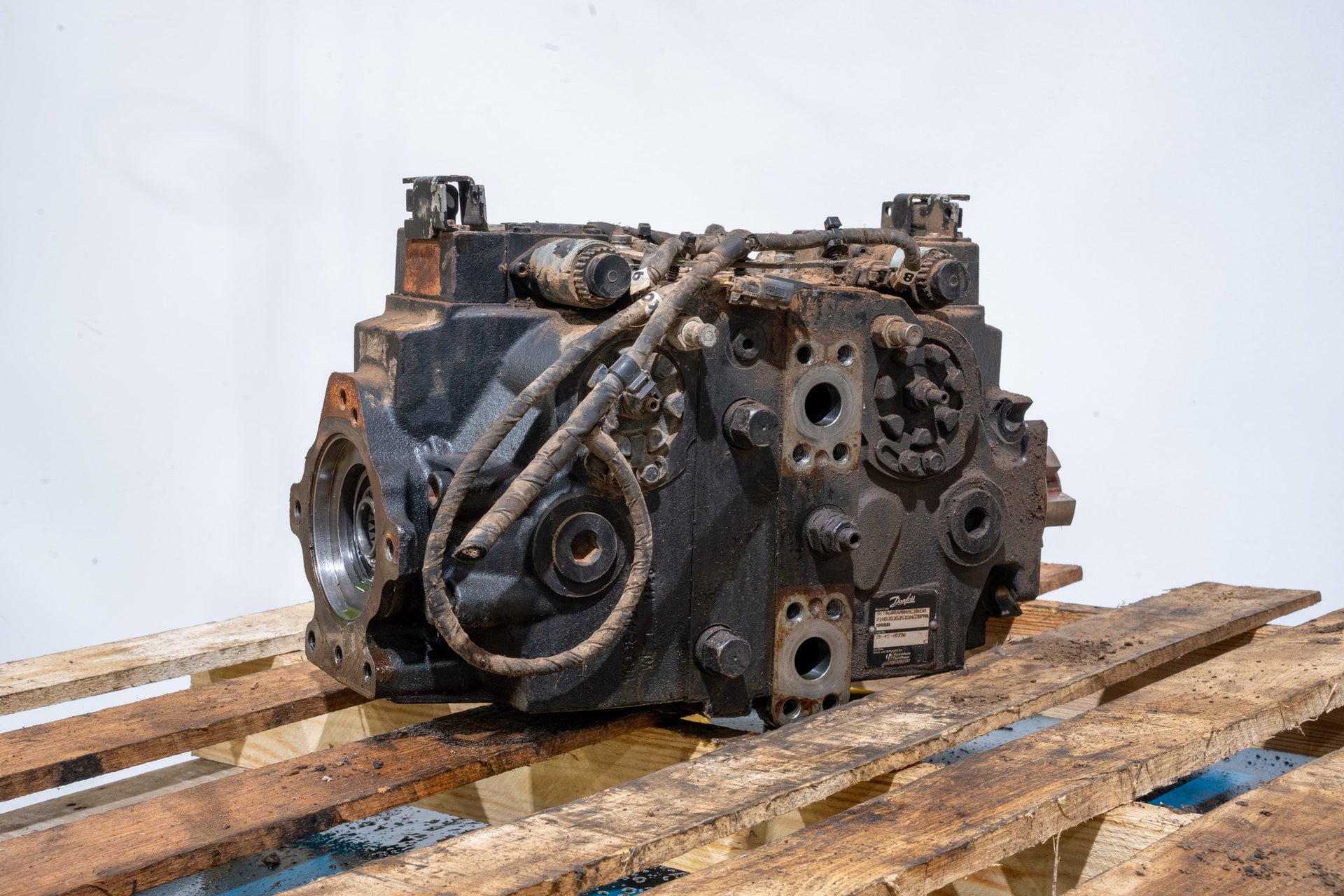 Hydrostatic Pump on wood pallet in front of white background