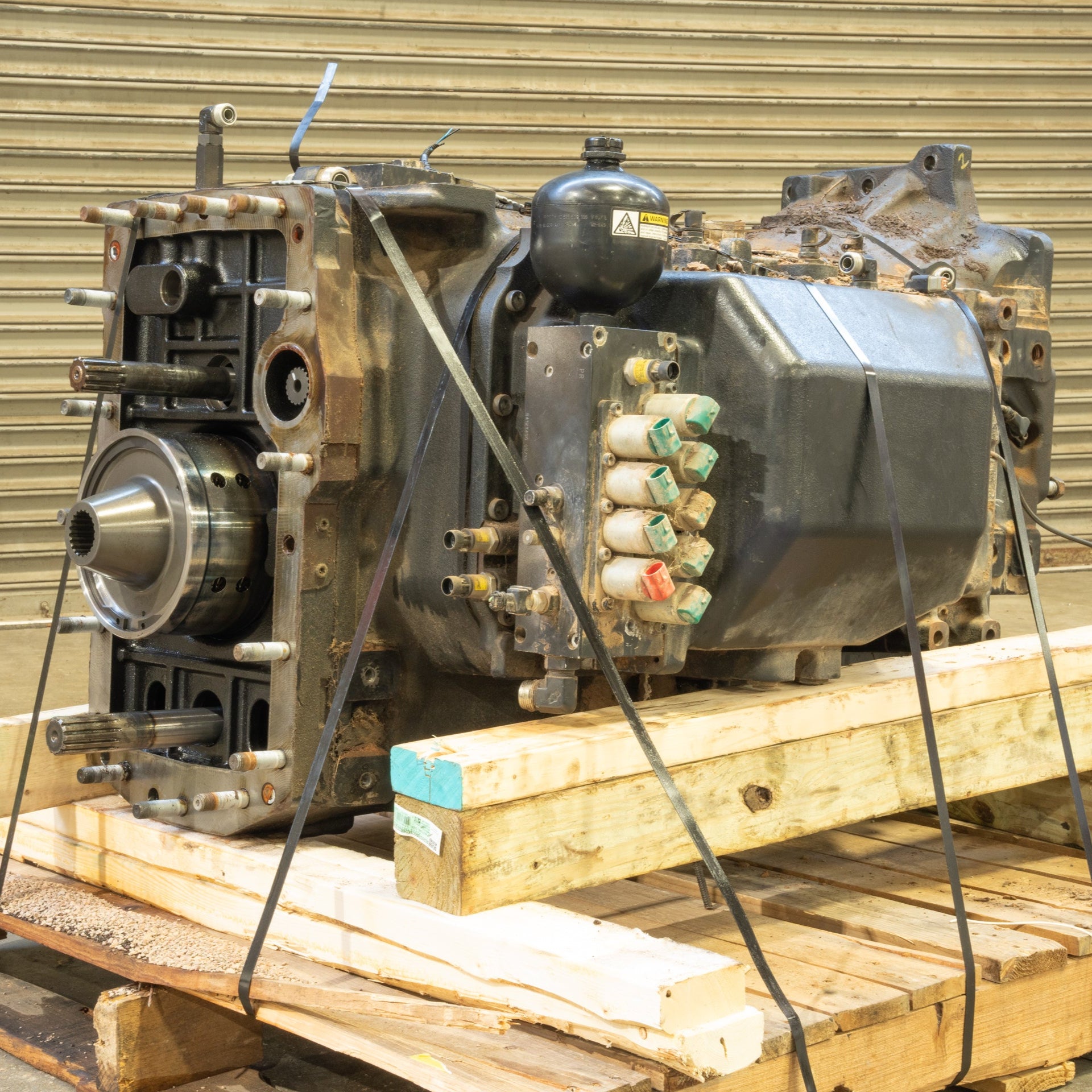 Puma 230 Transmission 3/4 front on side strapped to wood pallet