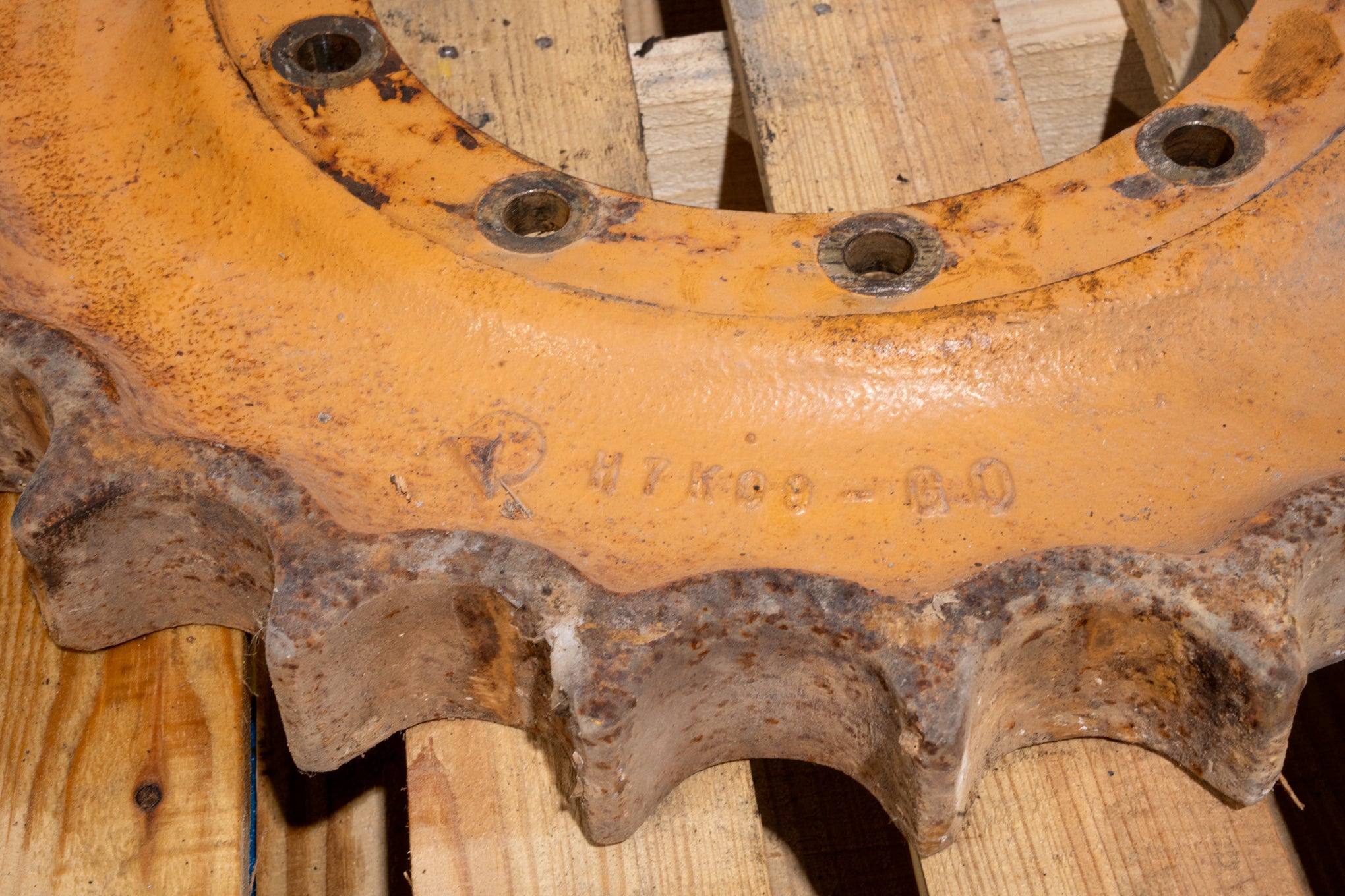 Sprocket 404056A1 Orange on pallet closeup casting number and teeth worn